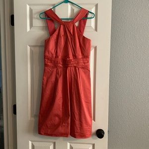 Beautiful David’s Bridal halter style with pockets. Coral midi dress
